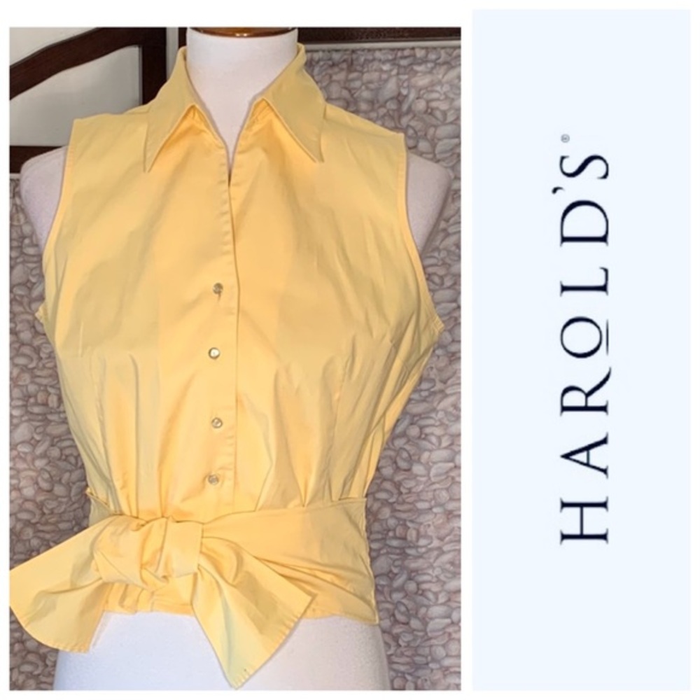Harold’s yellow sleeveless tie front shirt.